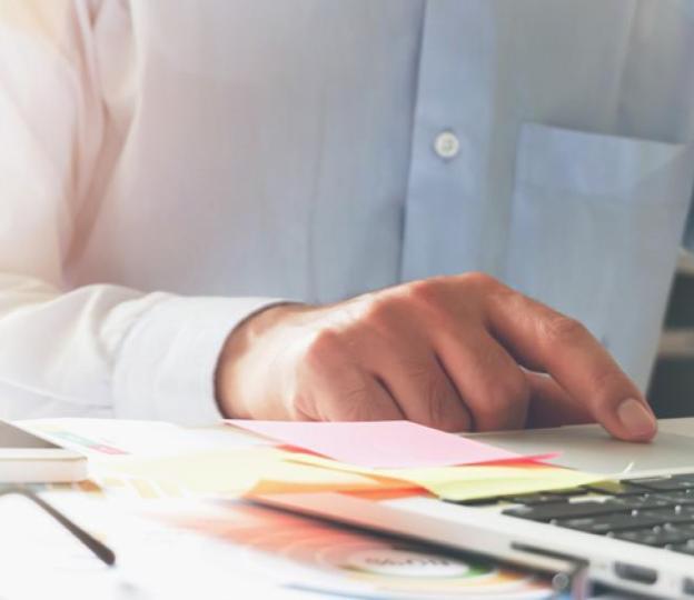 Person typing on laptop