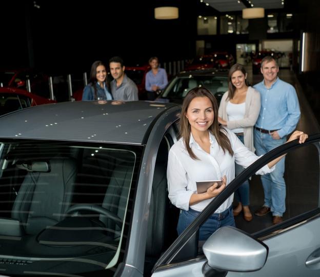 Car salesperson and customers