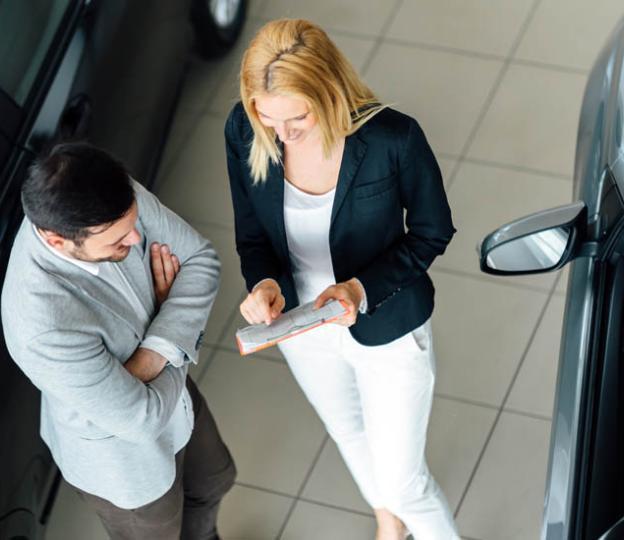 Salespeople looking at report