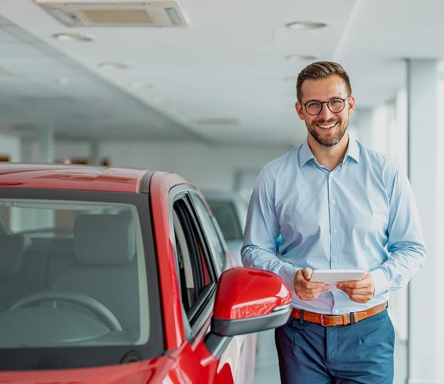 person standing next to a car