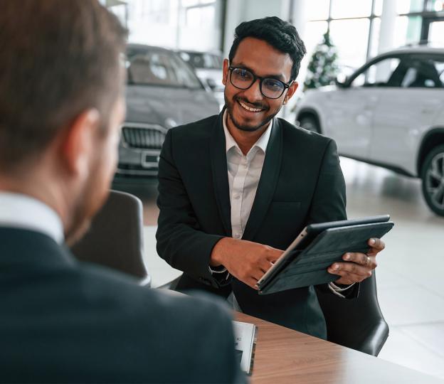 person showing customer tablet