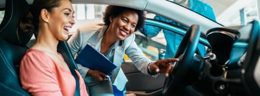 women looking at car